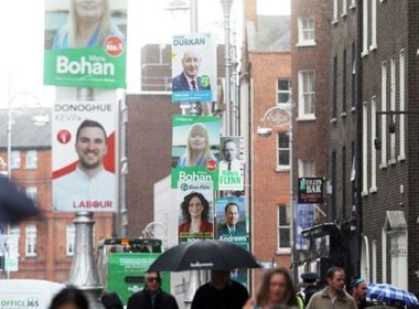 election posters on the street illustrating the focus on electoral politics